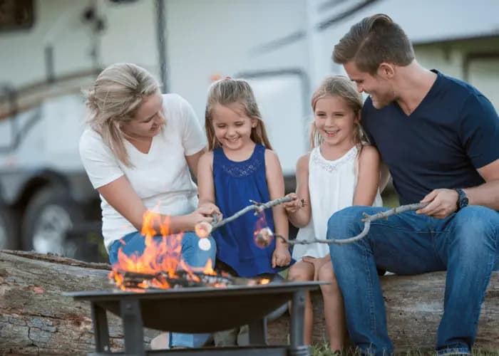 Family cooking outside RV